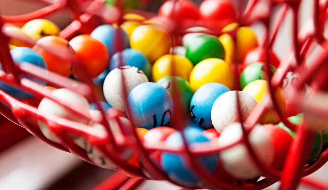 Closeup of brightly colored BINGO balls illustrating the blog topic of how to Play BINGO in Spanish!