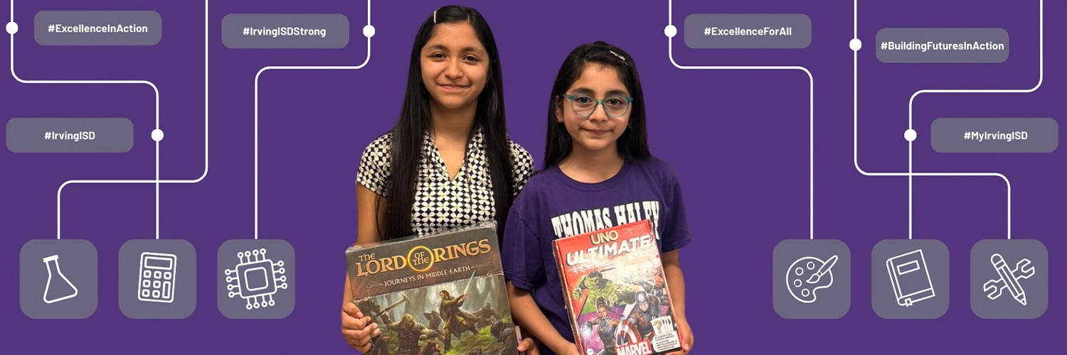 Two elementary students holding books at Thomas Haley Elementary School in Irving / Las Colinas ISD