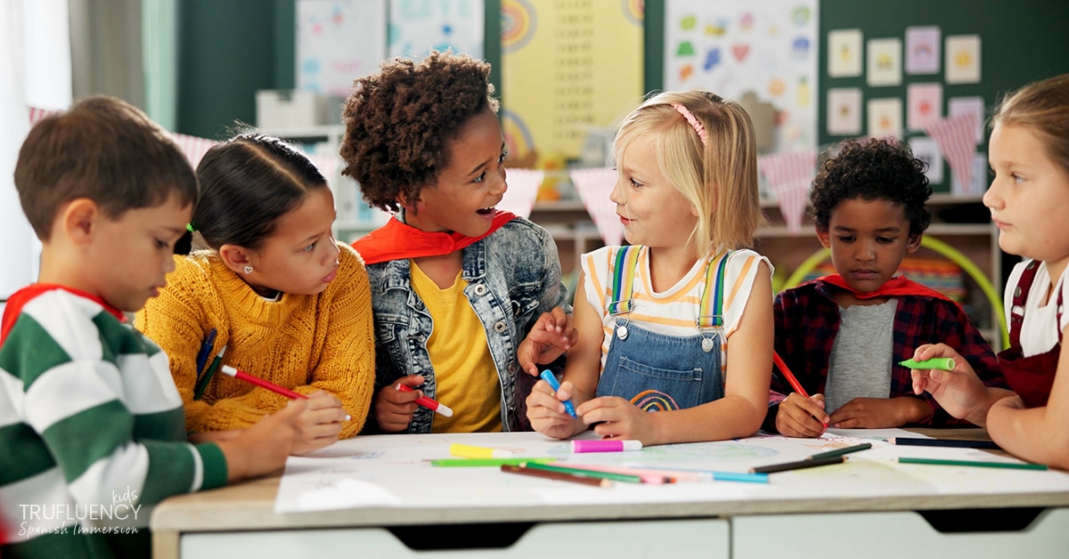 Children in an elementary classroom drawing and coloring at a table