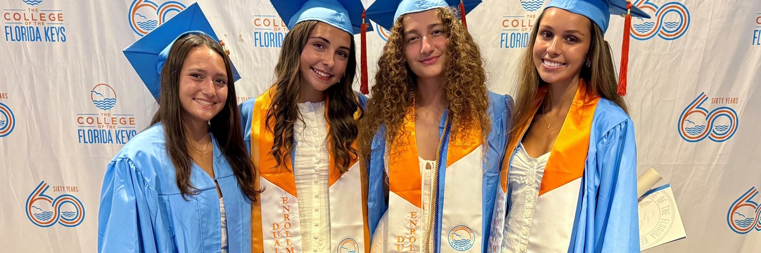 Four graduates wearing caps and gowns at Key West High School in Key West, Florida